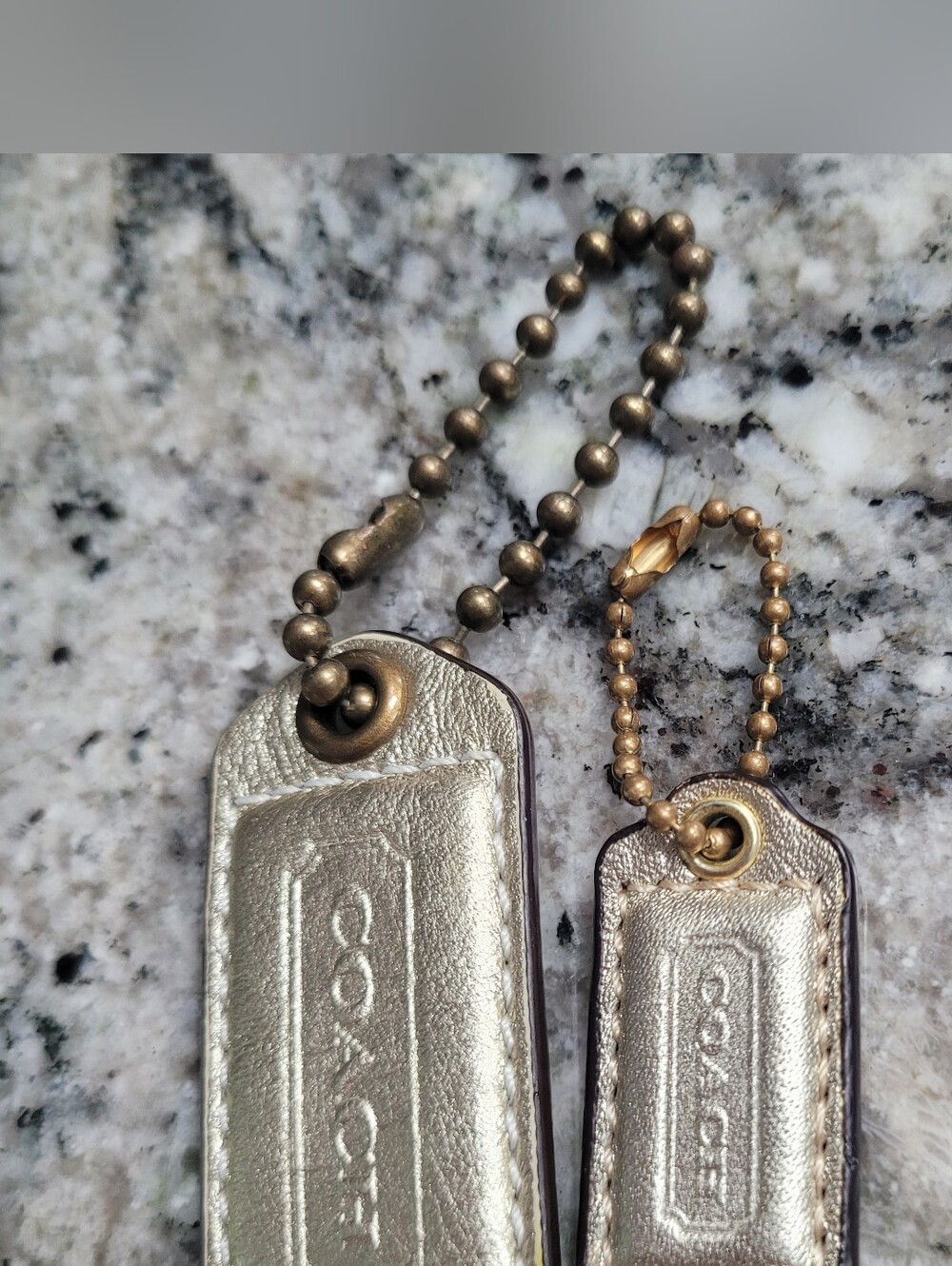 Coach Metallic & Brass Tags